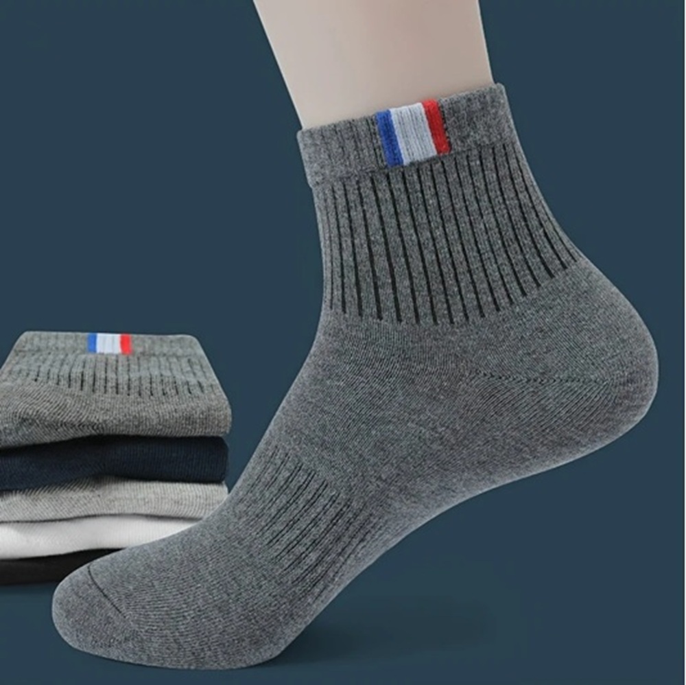 White Ribbed Ankle Sock with Tricolor Tab on Foot