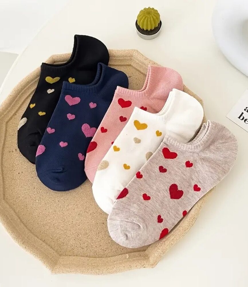 Navy and Red Heart Socks on Feet with Casual Sneakers